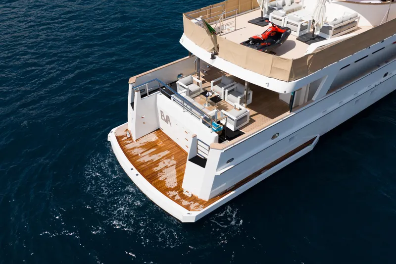 Eva Yacht Photos Pics Luxury 1993 Cheoy Lee Custom yacht with spacious deck and watercraft, cruising on open sea.