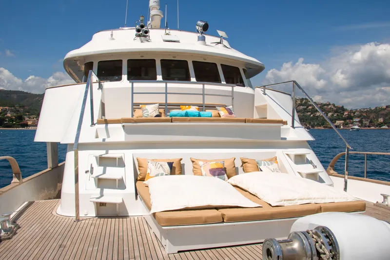Eva Yacht Photos Pics Luxurious 1993 Cheoy Lee Custom yacht with sunbathing deck, cruising on serene blue waters.