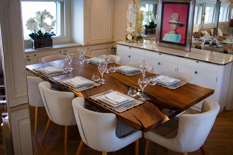 Eva Yacht Photos Pics Luxurious dining area on 1993 Cheoy Lee Custom yacht with elegant table setting.