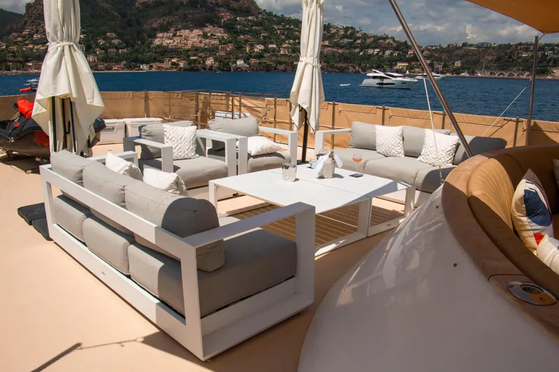 Eva Yacht Photos Pics Luxurious 1993 Cheoy Lee Custom yacht deck with elegant seating and scenic ocean view.