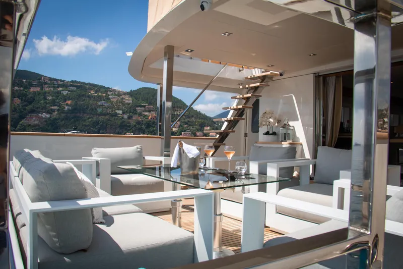 Eva Yacht Photos Pics Luxurious 1993 Cheoy Lee Custom yacht deck with elegant seating and scenic views.