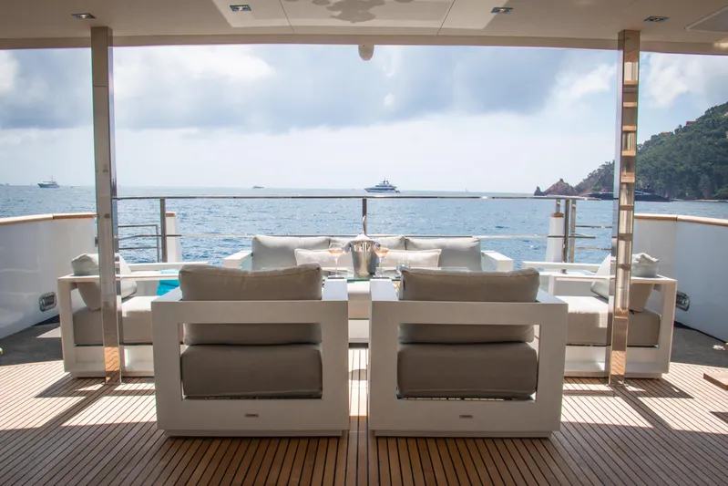 Eva Yacht Photos Pics Luxury yacht deck with modern seating, ocean view, Cheoy Lee Custom 1993 model.