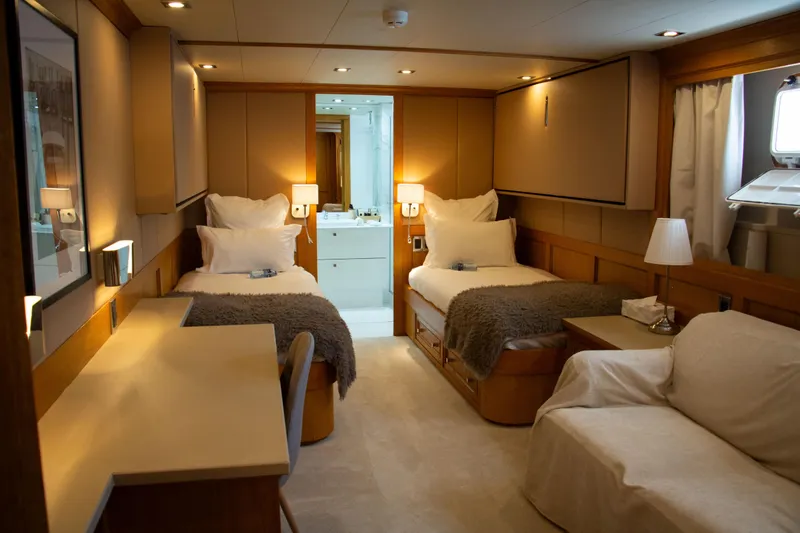 Eva Yacht Photos Pics Luxurious 1993 Cheoy Lee Custom yacht cabin with twin beds and elegant decor.