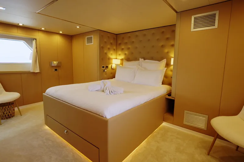 Eva Yacht Photos Pics Luxurious bedroom interior on 1993 Cheoy Lee Custom yacht, featuring elegant design and ambient lighting.