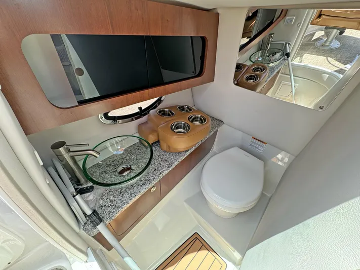  Yacht Photos Pics 2024 Crownline 290 XSS boat interior with modern bathroom amenities.