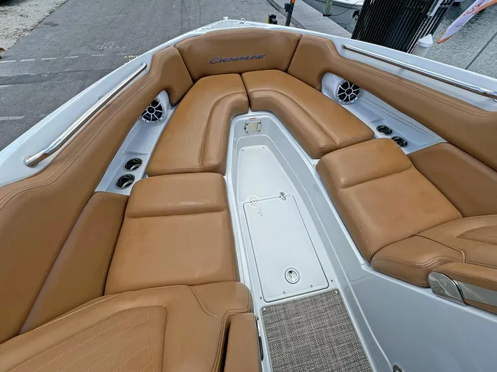  Yacht Photos Pics 2024 Crownline 290 XSS boat interior with tan leather seating and cup holders.