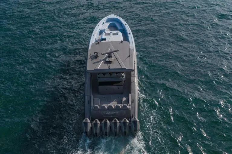  Yacht Photos Pics 2026 Midnight Express 52' Vitesse yacht cruising on open water, aerial view.