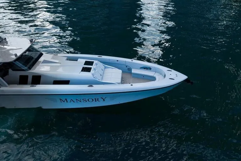  Yacht Photos Pics 2026 Midnight Express 52' Vitesse yacht on water, featuring sleek design and luxury seating.