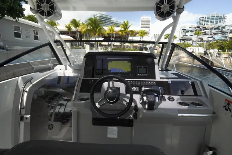  Yacht Photos Pics Cockpit view of 2021 Jeanneau Leader 10.5 WA boat with modern navigation system.