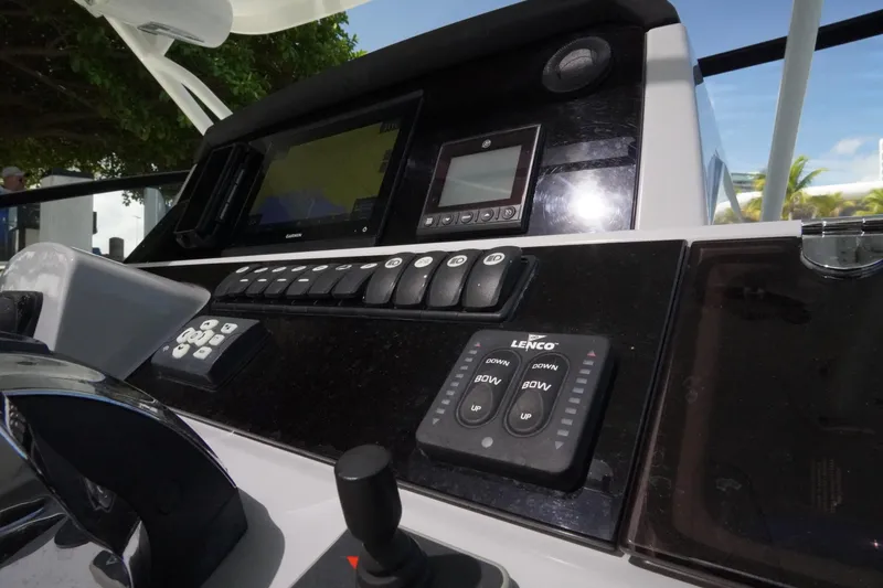  Yacht Photos Pics Control panel of 2021 Jeanneau Leader 10.5 WA boat with navigation and control systems.