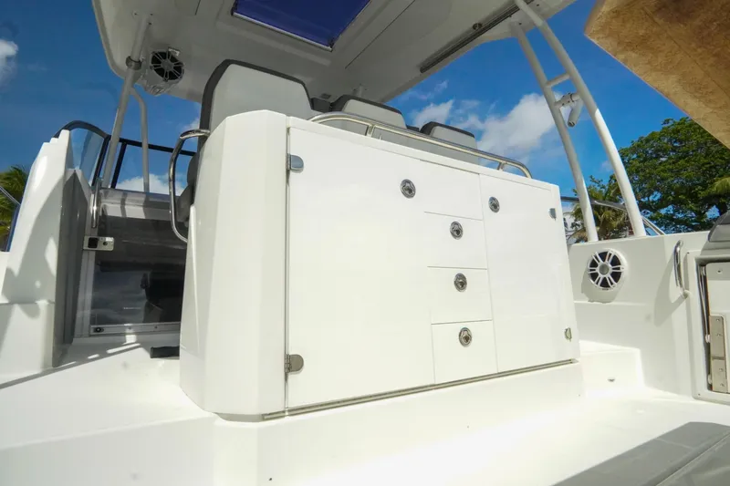  Yacht Photos Pics 2021 Jeanneau Leader 10.5 WA boat interior with white cabinetry and seating.