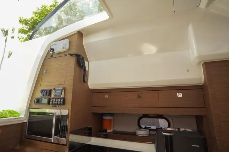  Yacht Photos Pics Interior of 2021 Jeanneau Leader 10.5 WA boat with modern kitchen amenities.