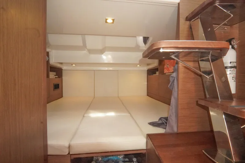  Yacht Photos Pics Interior cabin of 2021 Jeanneau Leader 10.5 WA with cozy sleeping area.