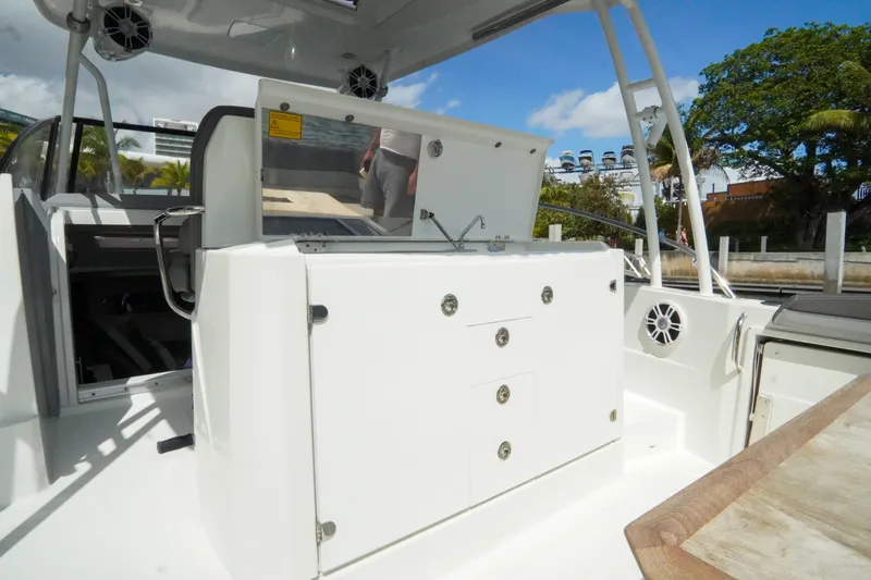  Yacht Photos Pics 2021 Jeanneau Leader 10.5 WA boat interior with seating and storage compartments.