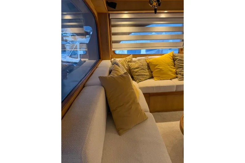  Yacht Photos Pics Interior of 1989 Buddy Davis 61 yacht with cozy seating and decorative pillows.