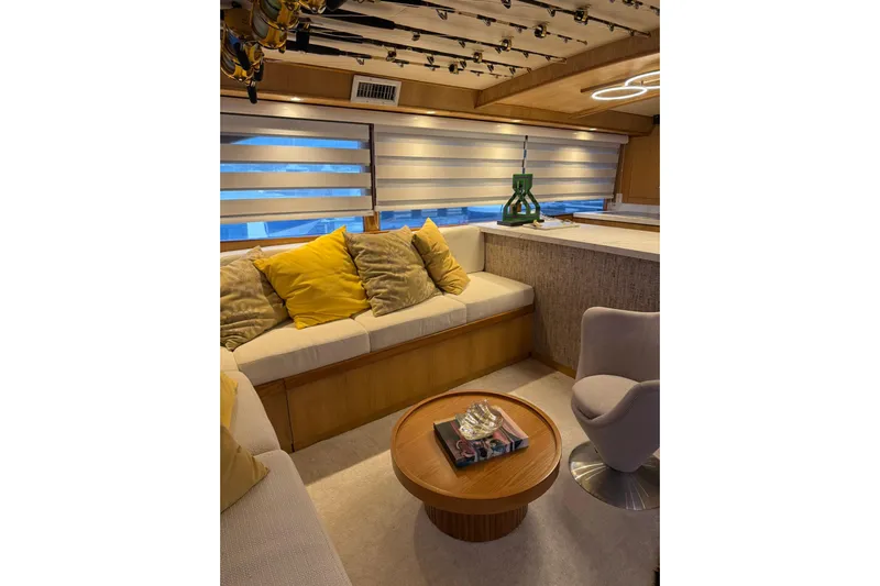  Yacht Photos Pics Luxurious interior of 1989 Buddy Davis 61 yacht with cozy seating and modern decor.