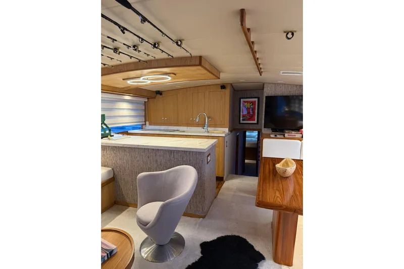  Yacht Photos Pics Luxurious interior of a 1989 Buddy Davis 61 yacht with modern kitchen and seating area.