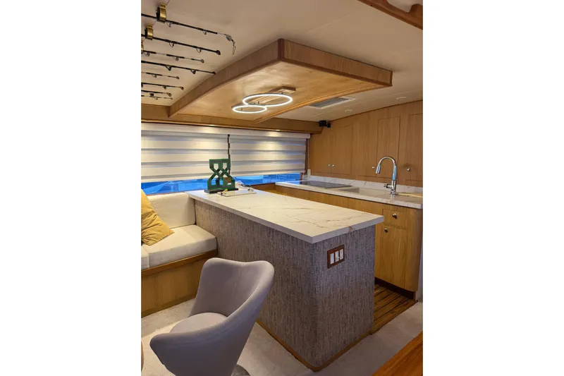  Yacht Photos Pics Luxurious interior of a 1989 Buddy Davis 61 yacht with modern kitchen and seating area.