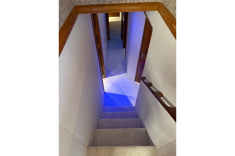  Yacht Photos Pics Staircase inside 1989 Buddy Davis 61 yacht with blue ambient lighting.
