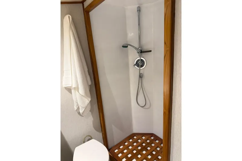  Yacht Photos Pics Shower area in 1989 Buddy Davis 61 yacht with wooden accents and white towel.