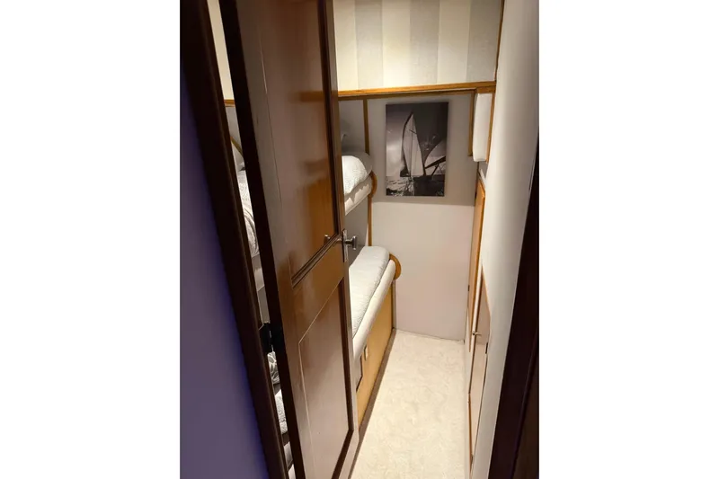  Yacht Photos Pics Cozy cabin with bunk beds in a 1989 Buddy Davis 61 yacht.