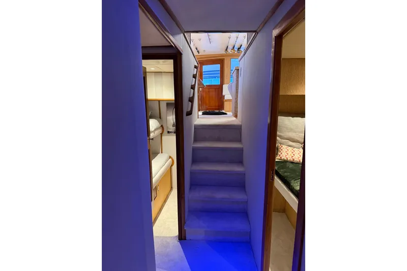  Yacht Photos Pics Interior view of 1989 Buddy Davis 61 yacht with cozy cabins and stairs.