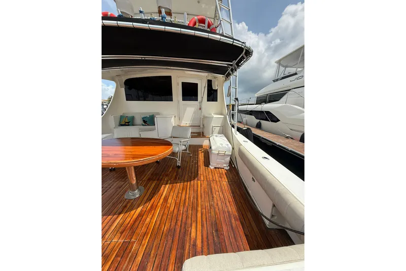  Yacht Photos Pics 1989 Buddy Davis 61 yacht deck with wooden flooring and seating area.