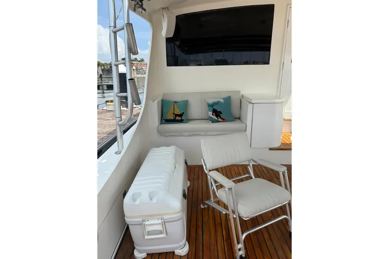  Yacht Photos Pics Interior of 1989 Buddy Davis 61 yacht with seating, cushions, and wooden flooring.