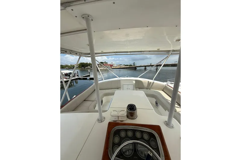  Yacht Photos Pics Interior view of 1989 Buddy Davis 61 yacht, showcasing helm and seating area.