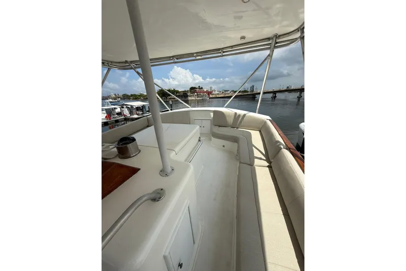  Yacht Photos Pics 1989 Buddy Davis 61 yacht deck with seating, overlooking marina and cityscape.