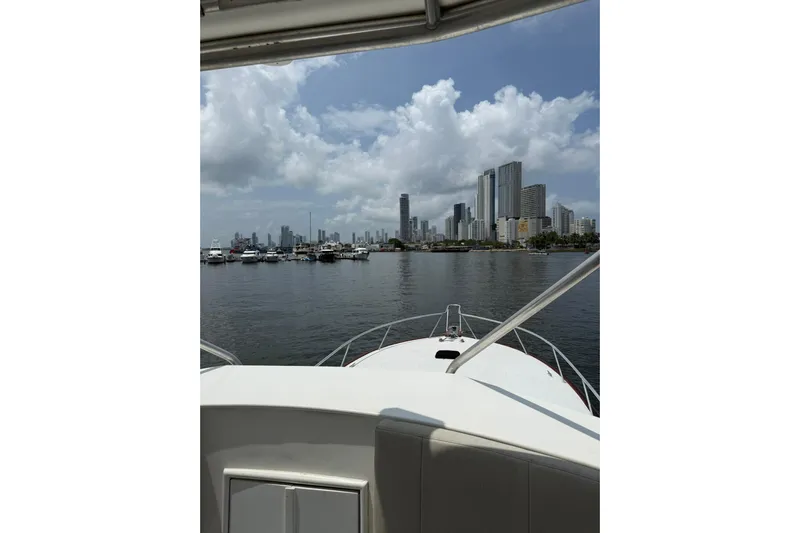  Yacht Photos Pics View from a 1989 Buddy Davis 61 yacht, overlooking a city skyline and marina.