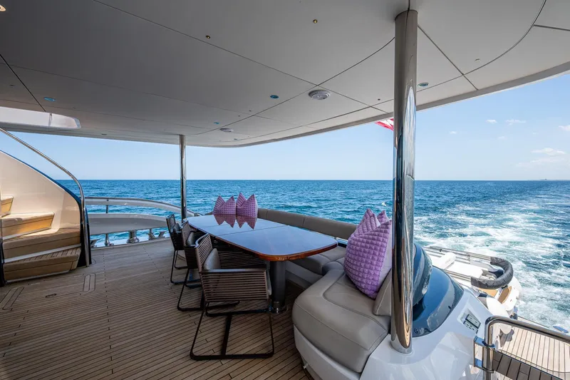 Splash Yacht Photos Pics Luxurious 2022 Princess X95 yacht deck with ocean view and elegant seating area.