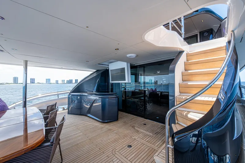 Splash Yacht Photos Pics Luxurious 2022 Princess X95 yacht deck with elegant staircase and ocean view.