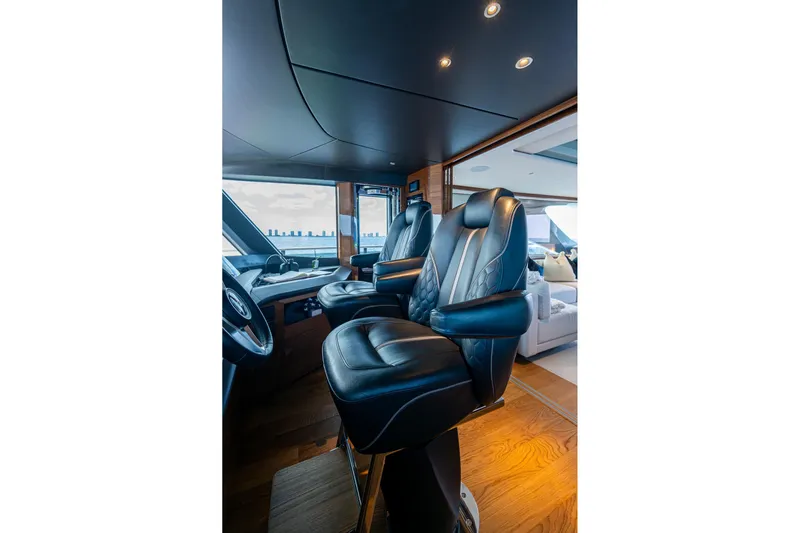 Splash Yacht Photos Pics Luxurious interior of 2022 Princess X95 yacht with plush leather seating.