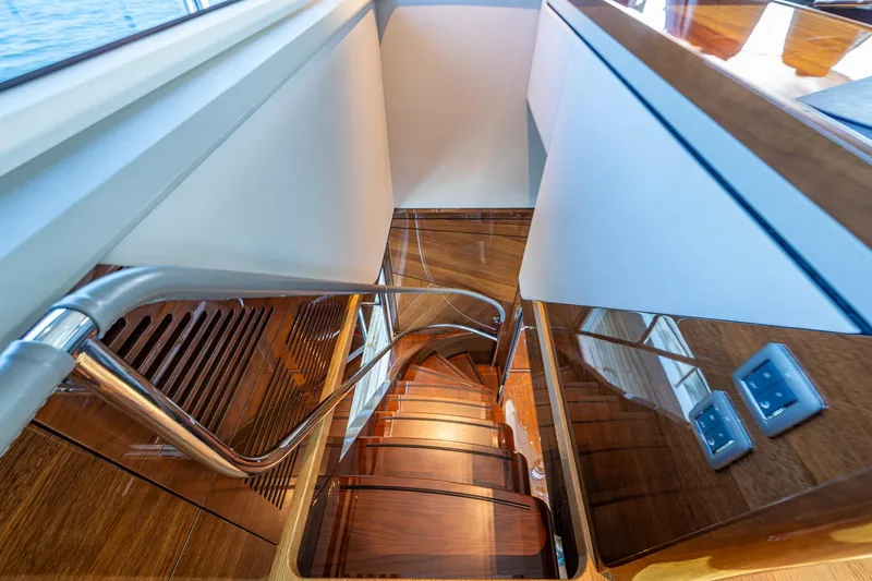 Splash Yacht Photos Pics Luxurious wooden staircase on 2022 Princess X95 yacht interior.