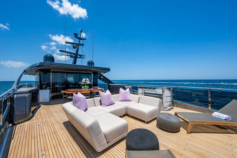 Splash Yacht Photos Pics Luxurious 2022 Princess X95 yacht deck with modern seating and ocean view.