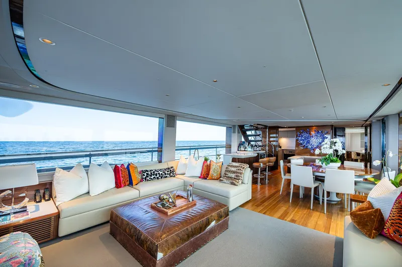 Splash Yacht Photos Pics Luxurious interior of 2022 Princess X95 yacht with ocean view, elegant seating, and dining area.