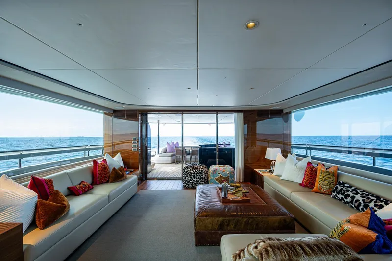 Splash Yacht Photos Pics Luxurious interior of 2022 Princess X95 yacht with ocean view, featuring elegant seating and decor.