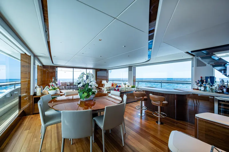 Splash Yacht Photos Pics Luxurious interior of 2022 Princess X95 yacht with elegant dining area and ocean views.