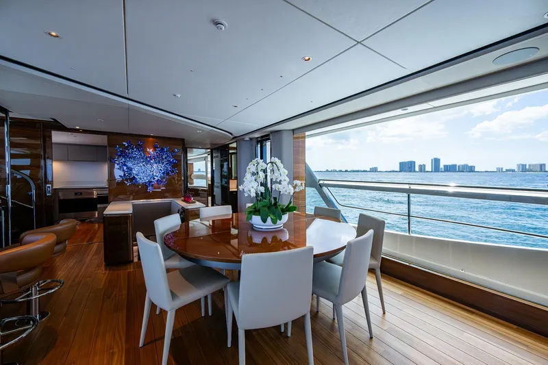 Splash Yacht Photos Pics Luxurious interior of 2022 Princess X95 yacht with ocean view and elegant dining area.
