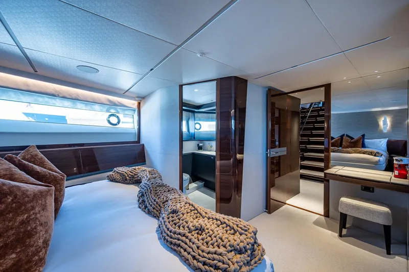 Splash Yacht Photos Pics Luxurious interior of 2022 Princess X95 yacht with modern bedroom and elegant decor.