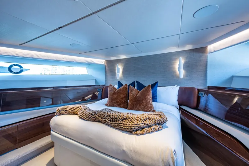 Splash Yacht Photos Pics Luxurious bedroom interior of 2022 Princess X95 yacht with elegant decor and modern lighting.