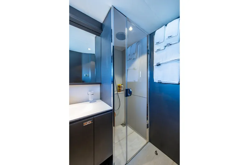 Splash Yacht Photos Pics Luxurious bathroom in 2022 Princess X95 yacht with modern shower and sleek design.