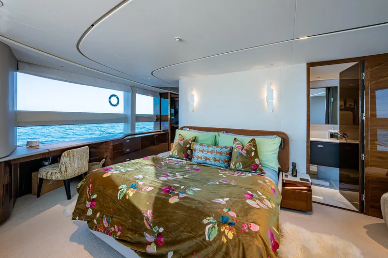 Splash Yacht Photos Pics Luxurious bedroom interior on 2022 Princess X95 yacht with ocean view and elegant decor.