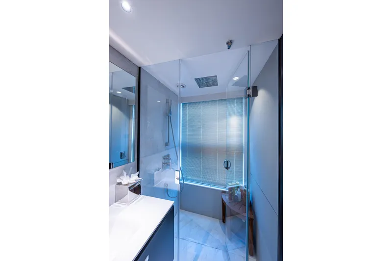 Splash Yacht Photos Pics Luxurious bathroom in 2022 Princess X95 yacht with glass shower and modern fixtures.