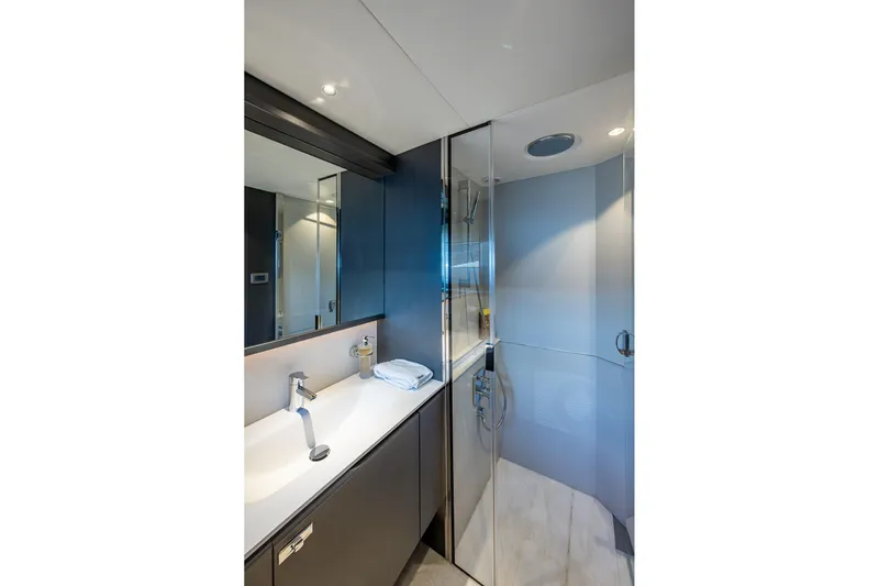 Splash Yacht Photos Pics Luxurious bathroom in 2022 Princess X95 yacht with modern fixtures and glass shower.