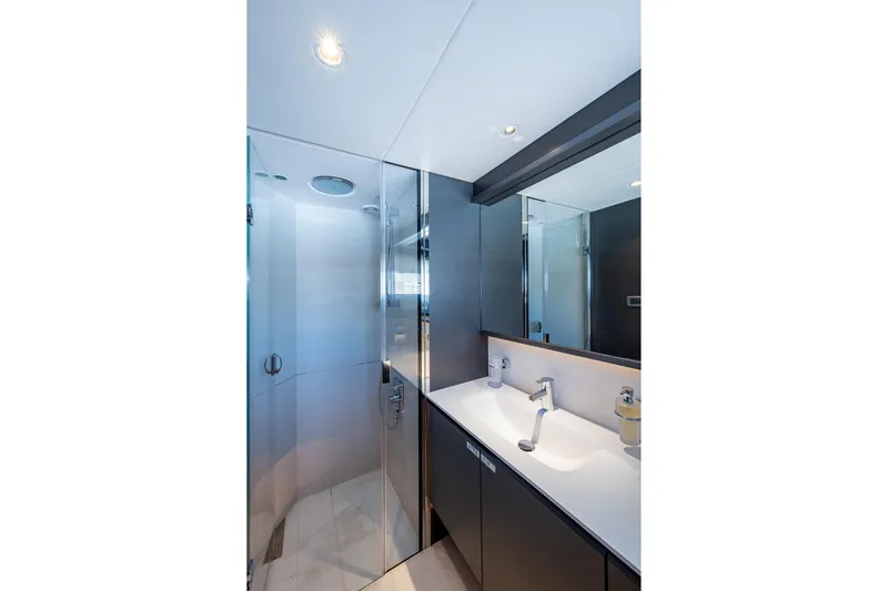 Splash Yacht Photos Pics Luxurious bathroom on 2022 Princess X95 yacht with modern fixtures and glass shower.