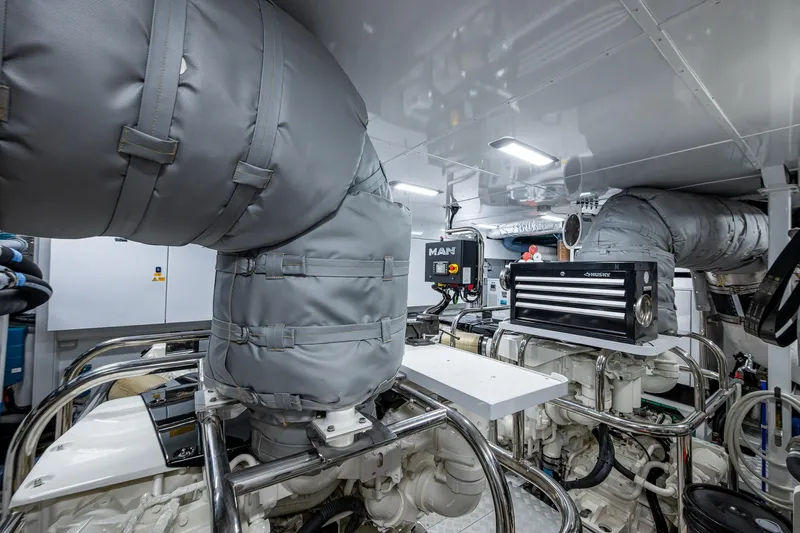 Splash Yacht Photos Pics Engine room of 2022 Princess X95 yacht with insulated pipes and control systems.