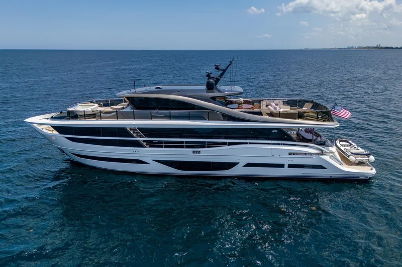 Splash Yacht Photos Pics Luxurious 2022 Princess X95 yacht cruising on open sea under clear skies.
