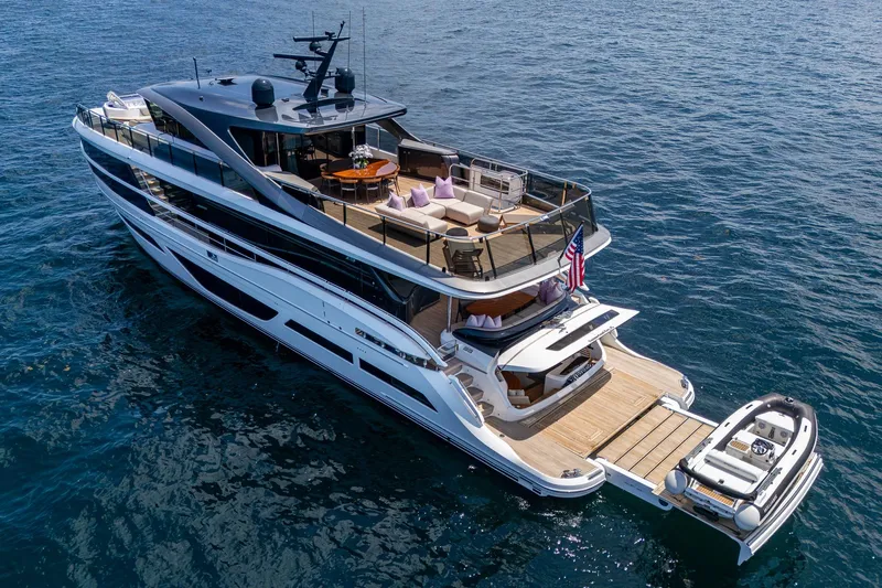 Splash Yacht Photos Pics Luxurious 2022 Princess X95 yacht cruising on open water, featuring spacious decks and elegant design.